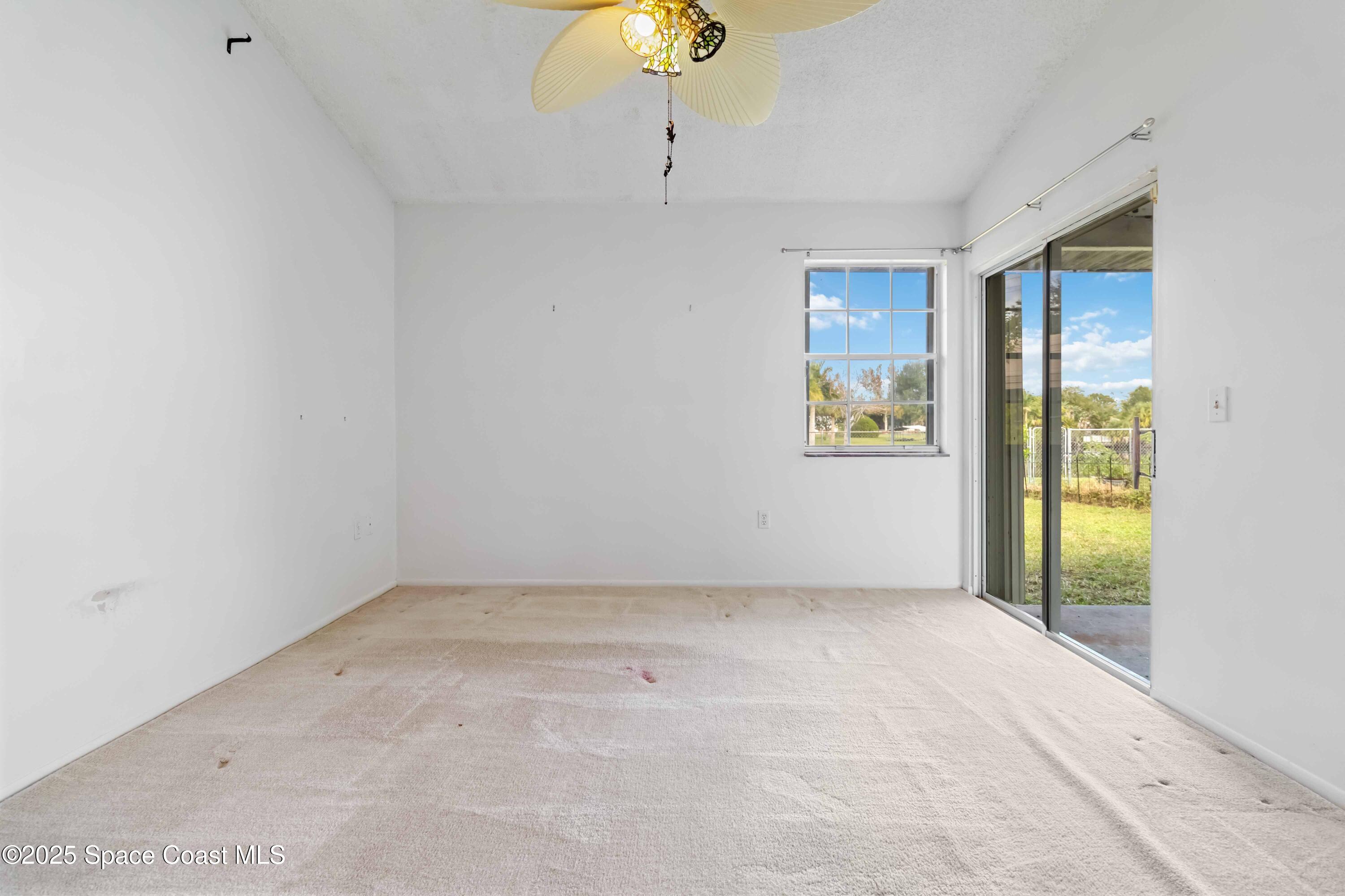 3728 West Malory Court Cocoa, FL 32926 - Photo 24 of 37 an empty room with windows