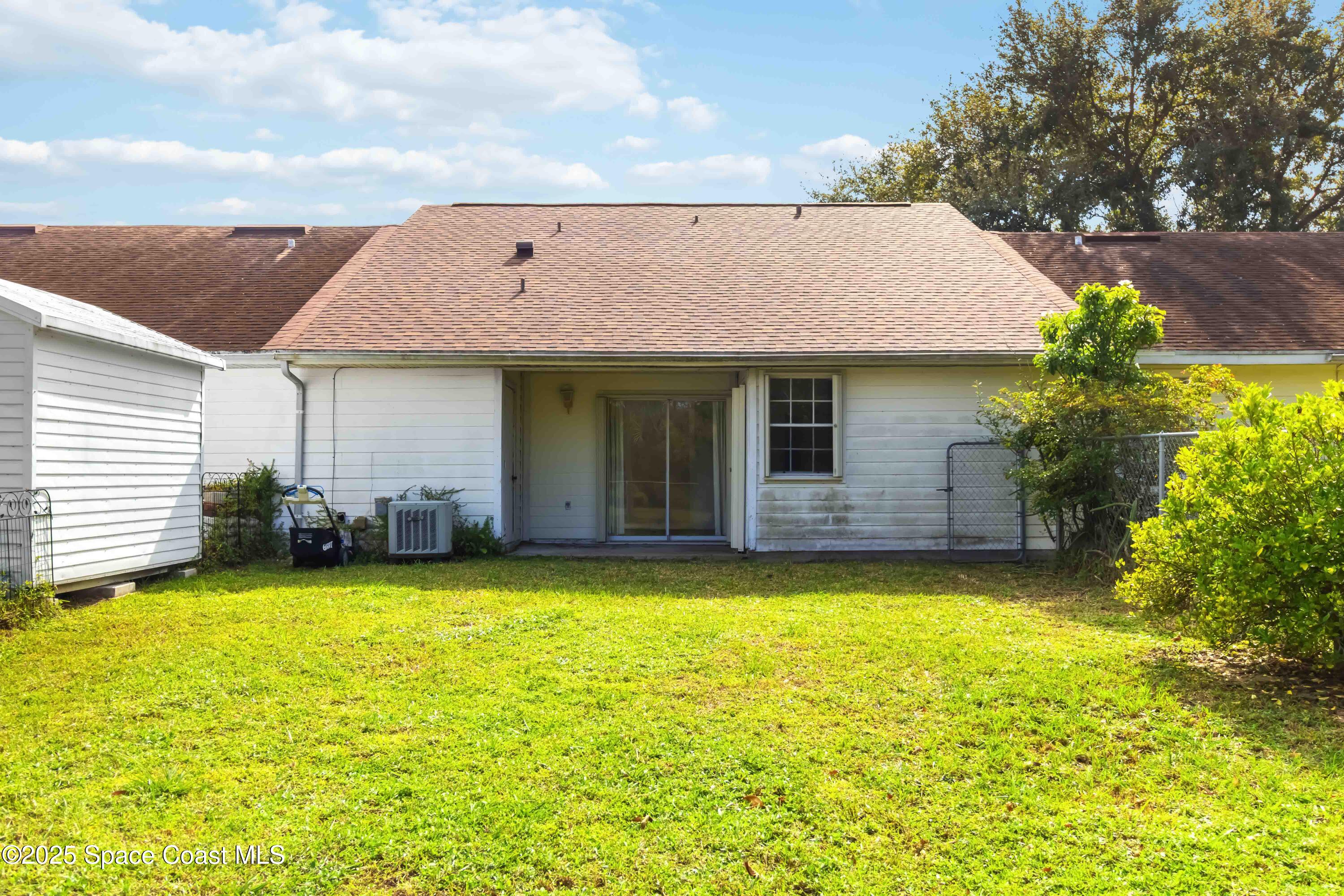 3728 West Malory Court Cocoa, FL 32926 - Photo 30 of 37 a view of a house with a yard and sitting area