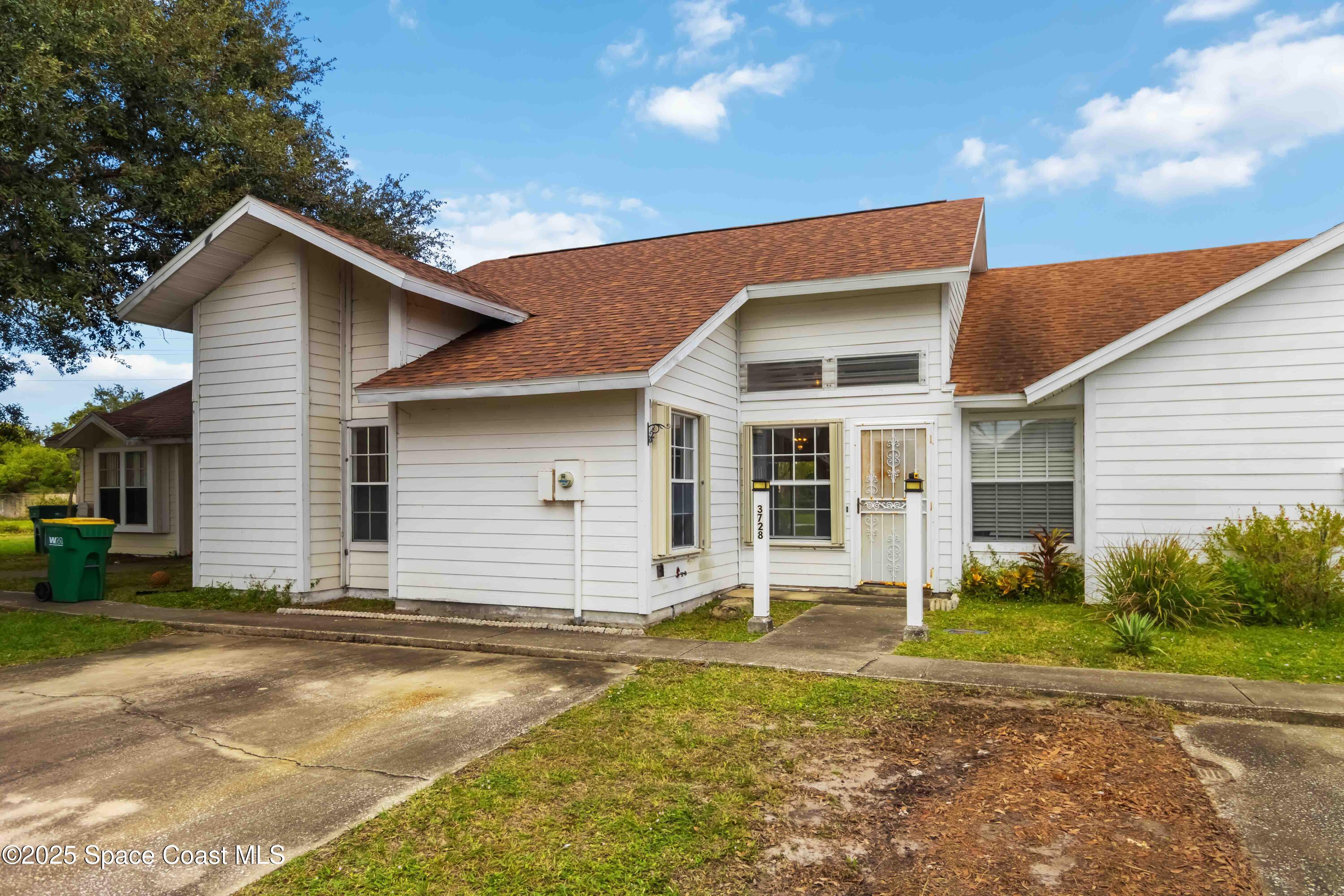 3728 West Malory Court Cocoa, FL 32926 - Photo 3 of 37 a front view of a house with garden