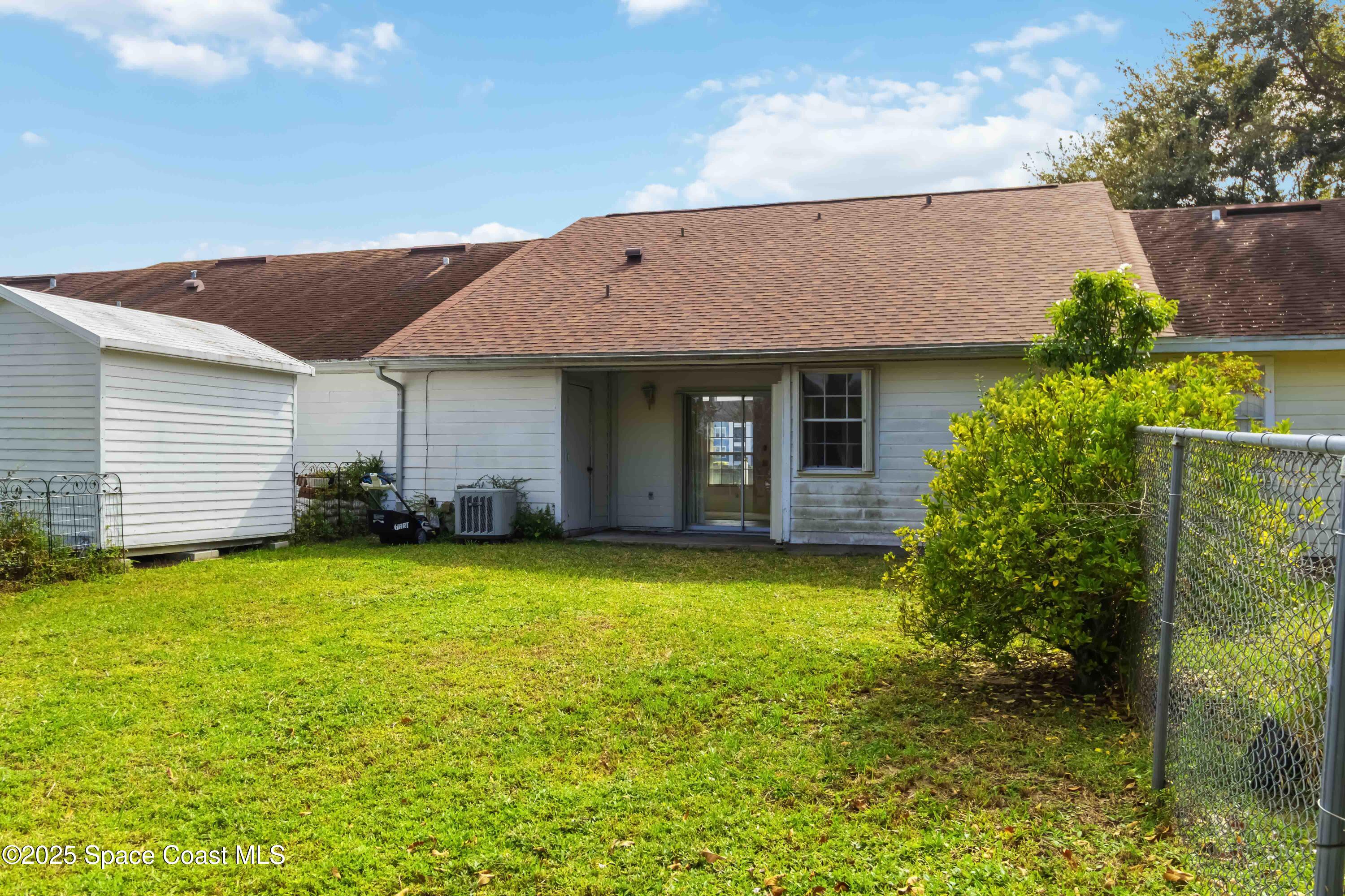 3728 West Malory Court Cocoa, FL 32926 - Photo 31 of 37 a front view of a house with a garden
