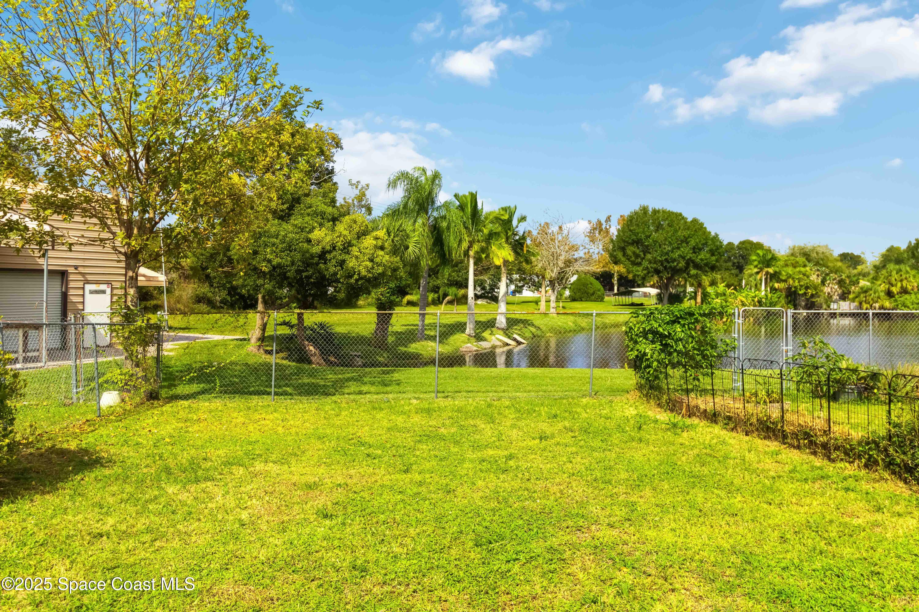 3728 West Malory Court Cocoa, FL 32926 - Photo 33 of 37 a view of a swimming pool with a lake view