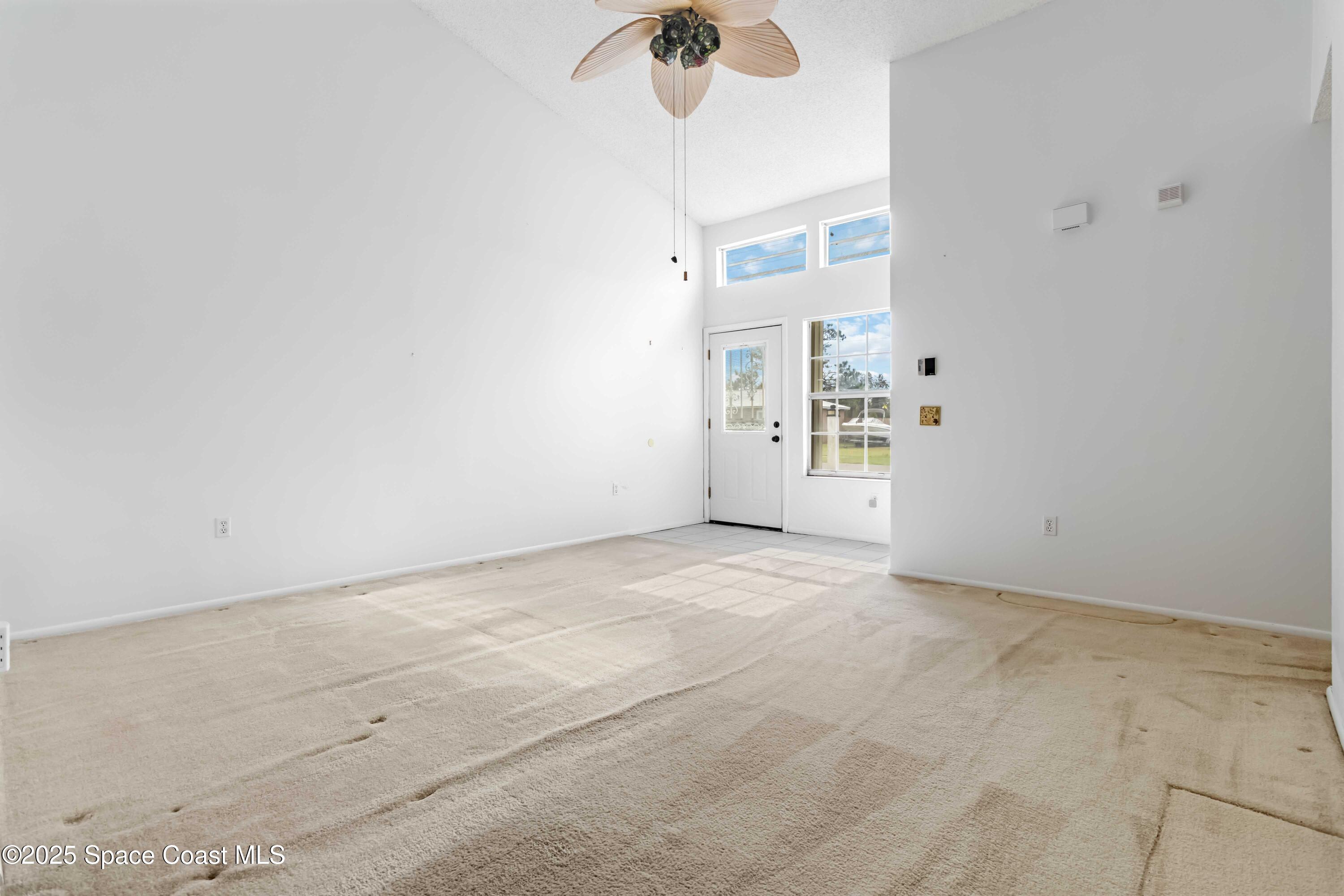 3728 West Malory Court Cocoa, FL 32926 - Photo 4 of 37 a view of a room with wooden floor