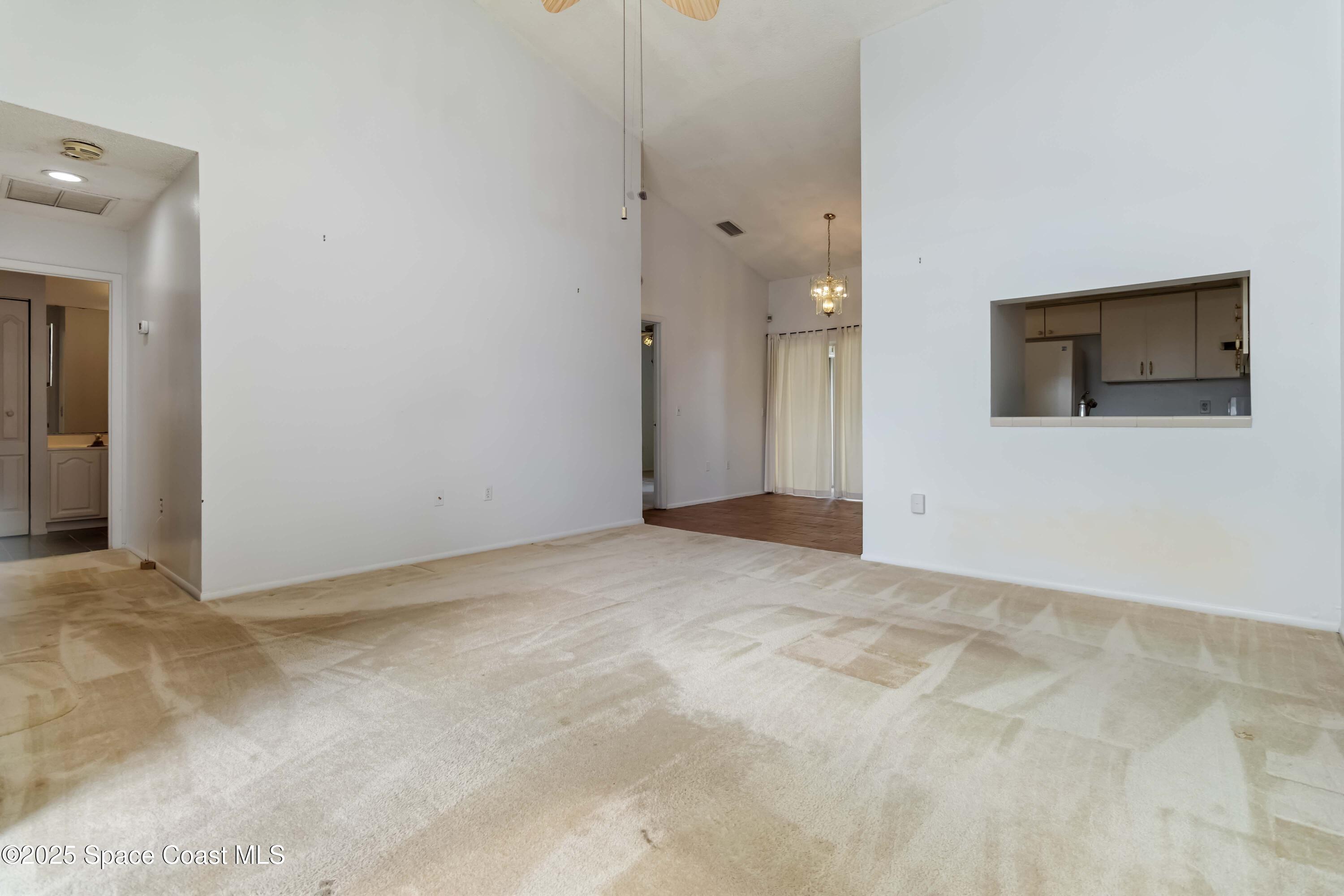3728 West Malory Court Cocoa, FL 32926 - Photo 6 of 37 a view of a livingroom with a flat screen tv