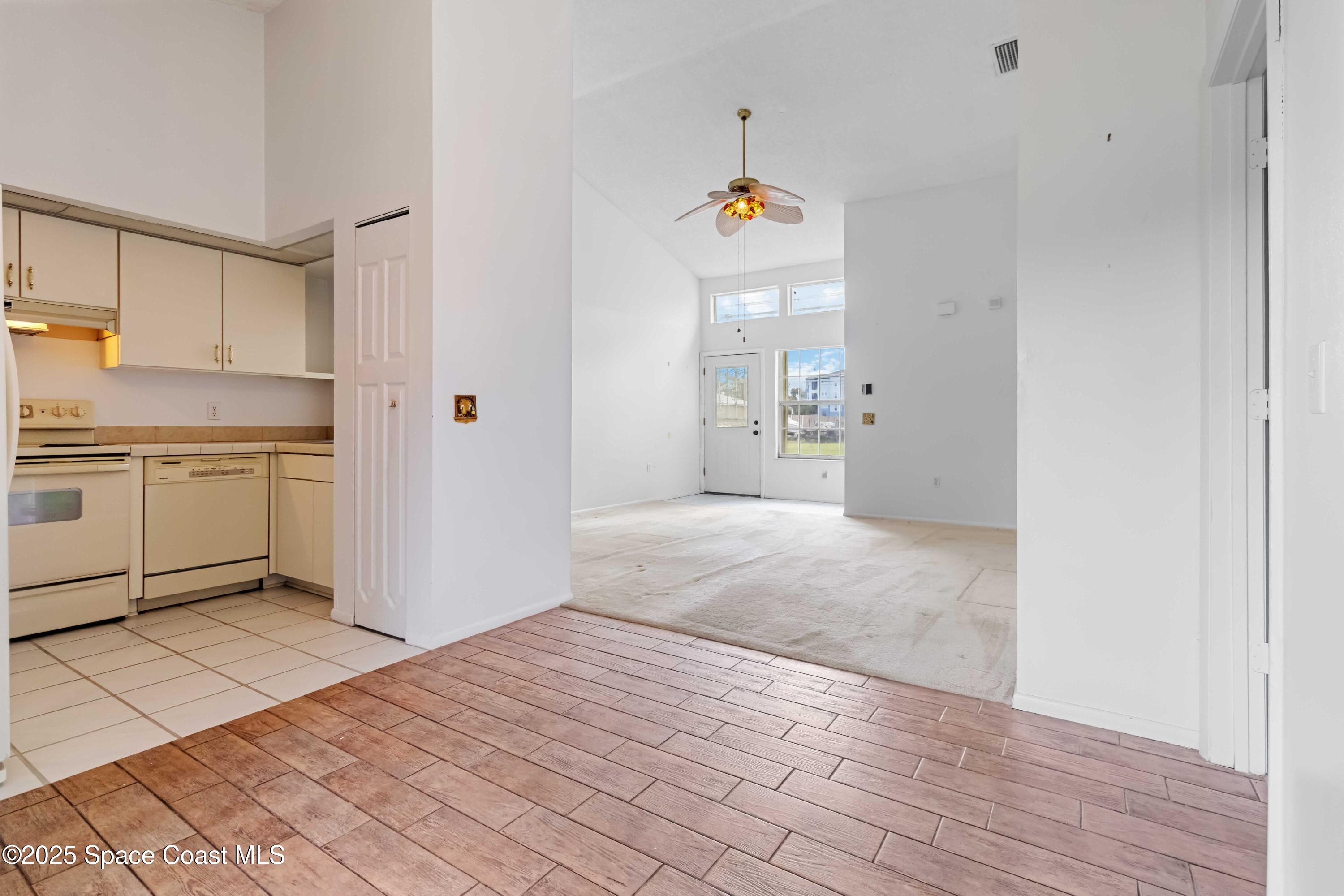 3728 West Malory Court Cocoa, FL 32926 - Photo 8 of 17 a bathroom with a sink and a refrigerator