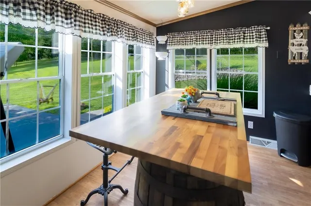 a view of a dining room with furniture window and wooden floor