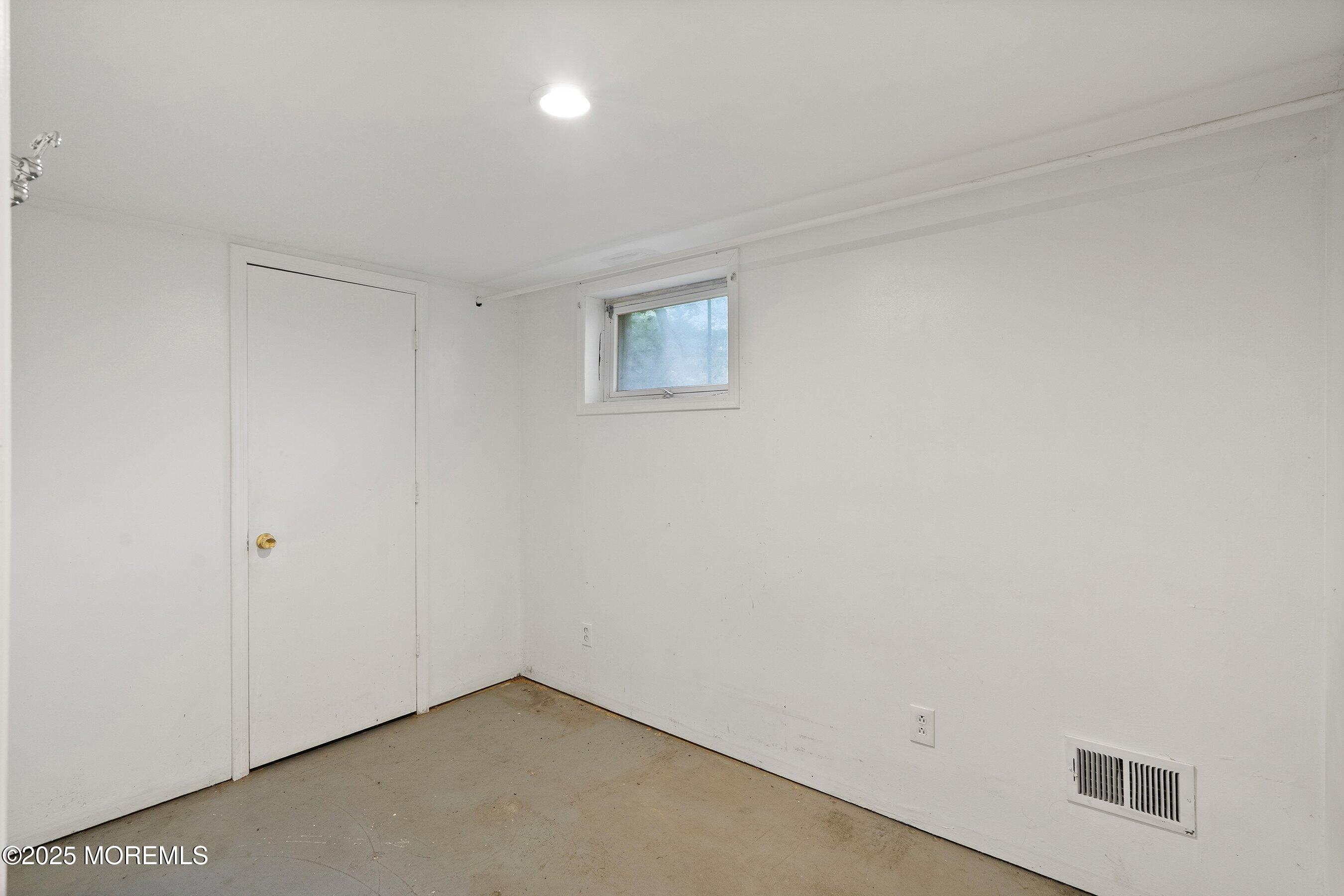 2148 Allenwood Road Wall, NJ 07719 - Photo 18 of 27 an empty room with a workbench