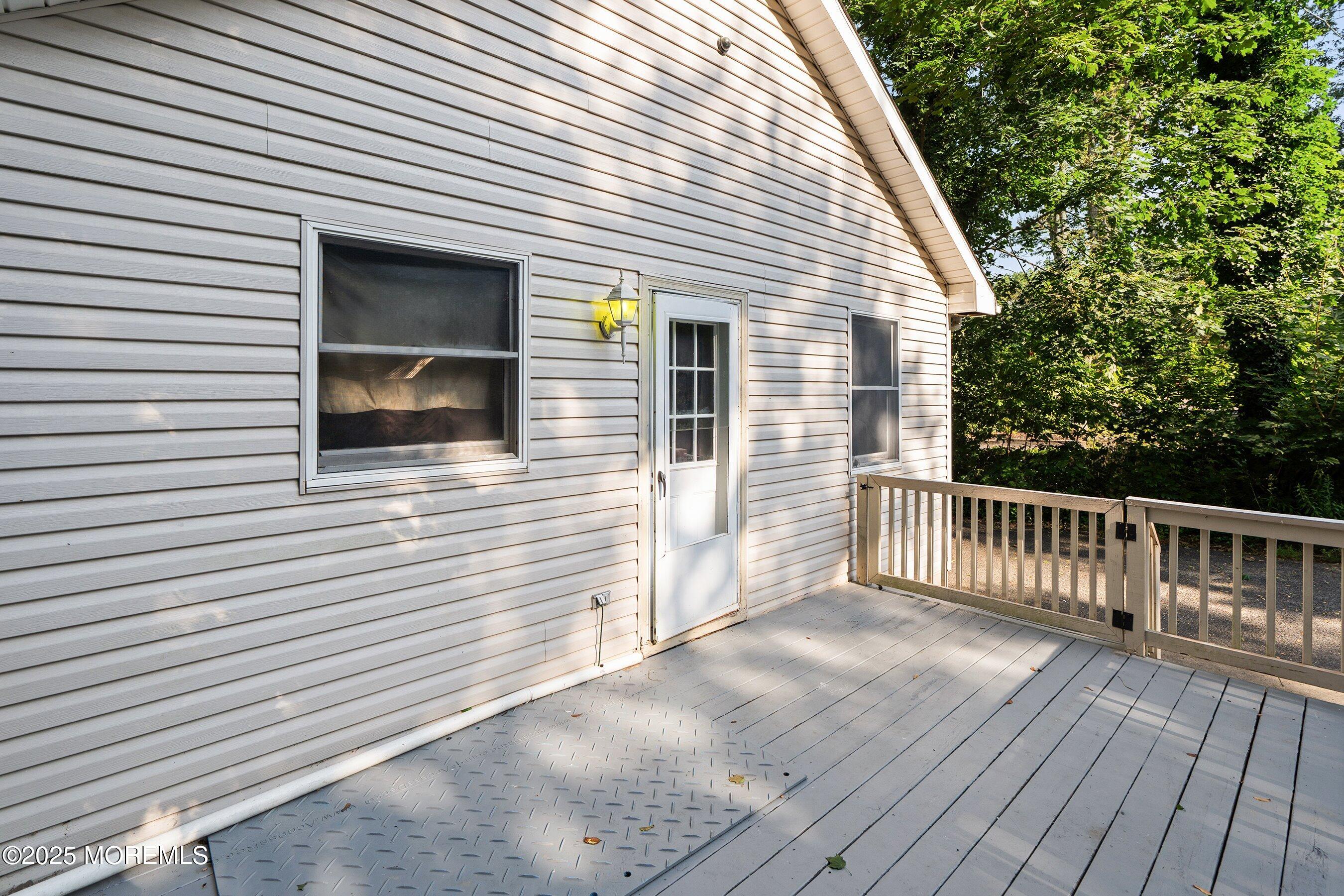 2148 Allenwood Road Wall, NJ 07719 - Photo 19 of 27 a view of a house with wooden deck
