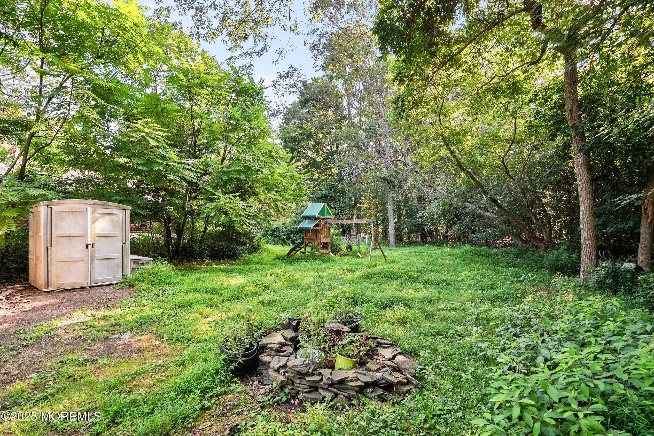 2148 Allenwood Road Wall, NJ 07719 - Photo 20 of 27 a backyard of a house with lots of green space