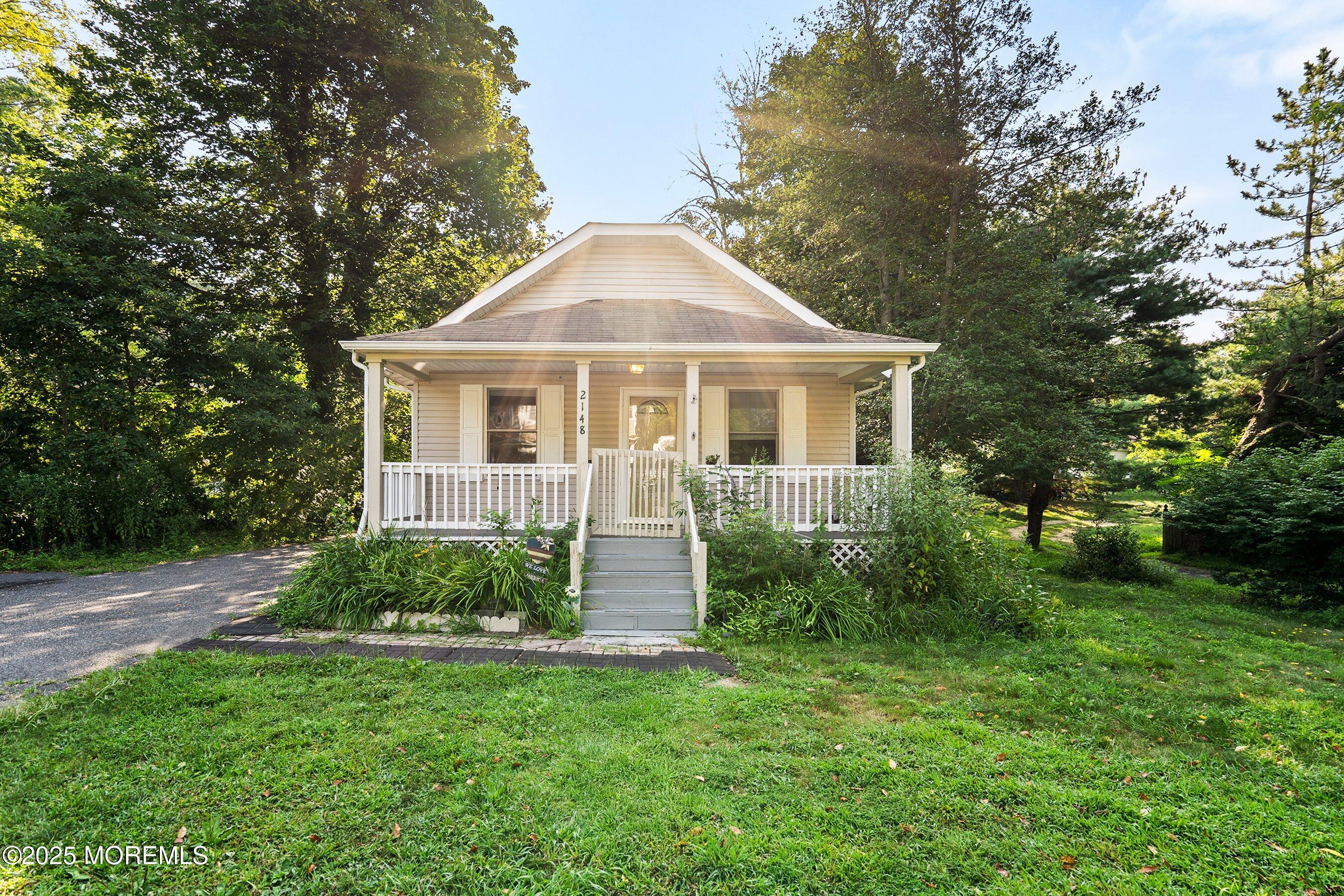 2148 Allenwood Road Wall, NJ 07719 - Photo 3 of 27 a front view of a house with a yard
