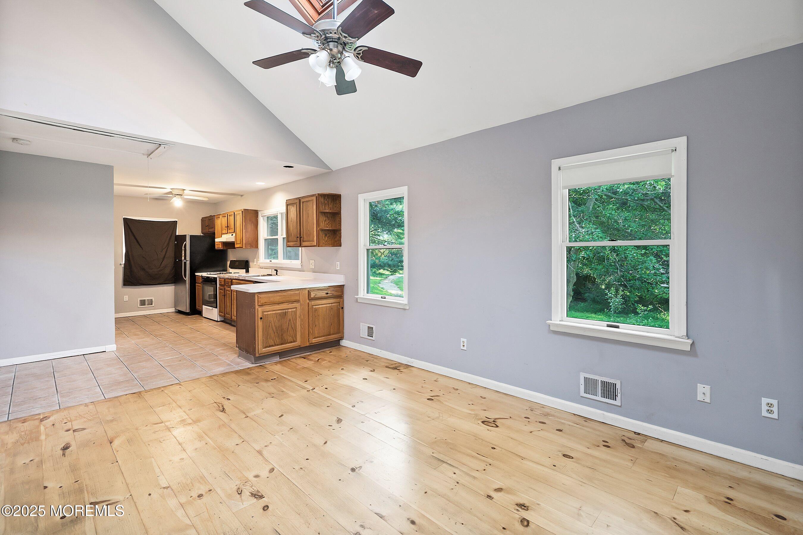 2148 Allenwood Road Wall, NJ 07719 - Photo 4 of 27 a view of a kitchen with a sink hardwood floor and a window