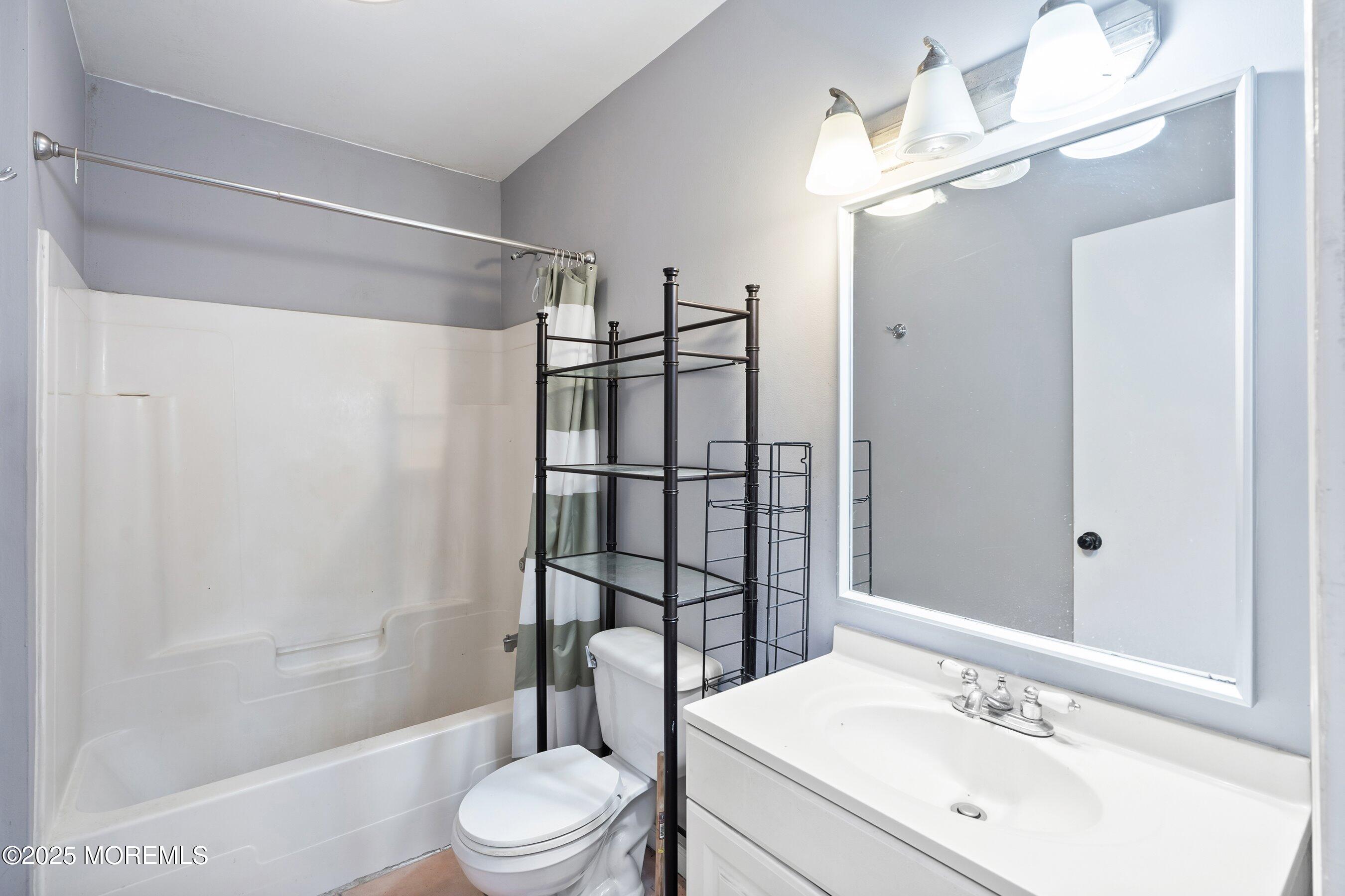 2148 Allenwood Road Wall, NJ 07719 - Photo 8 of 27 a bathroom with a sink toilet and shower