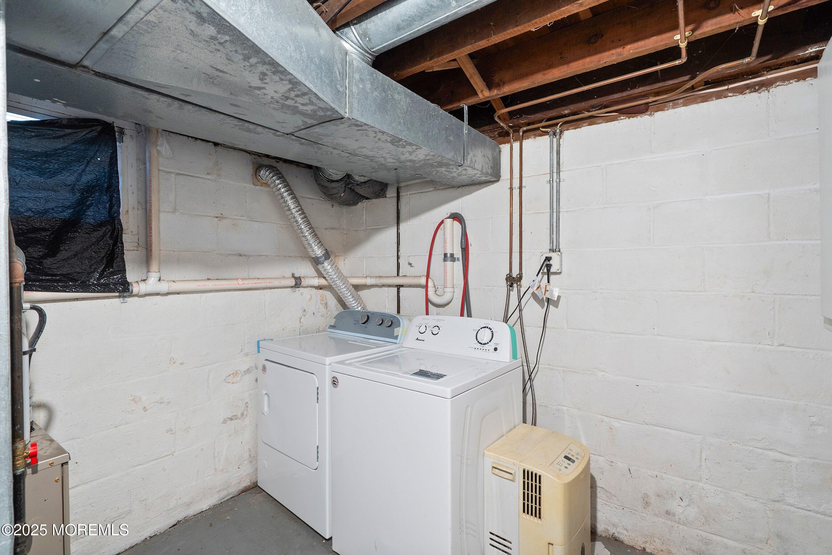 2148 Allenwood Road Wall, NJ 07719 - Photo 9 of 27 a utility room with dryer and washer