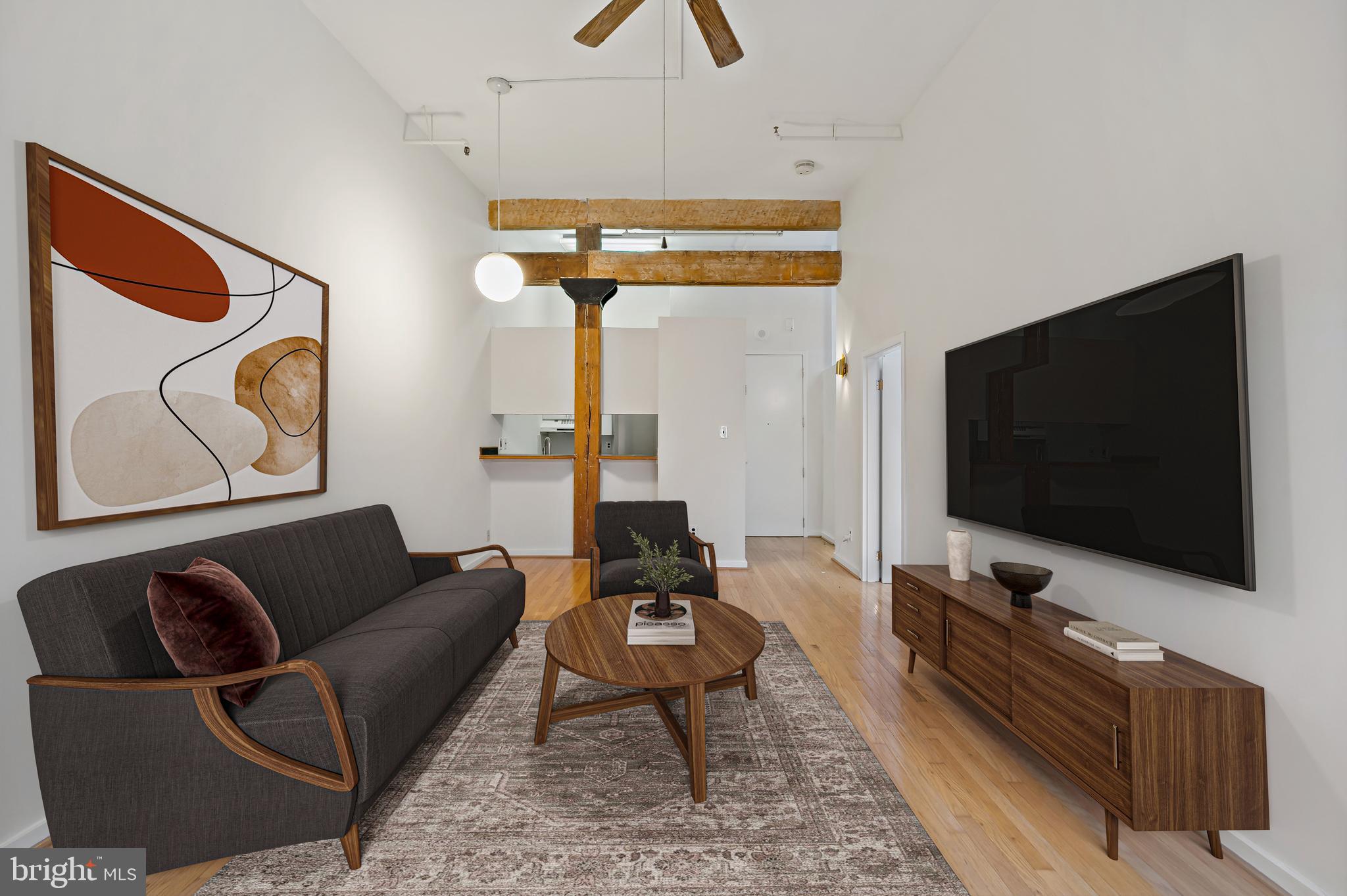 a living room with furniture and a flat screen tv