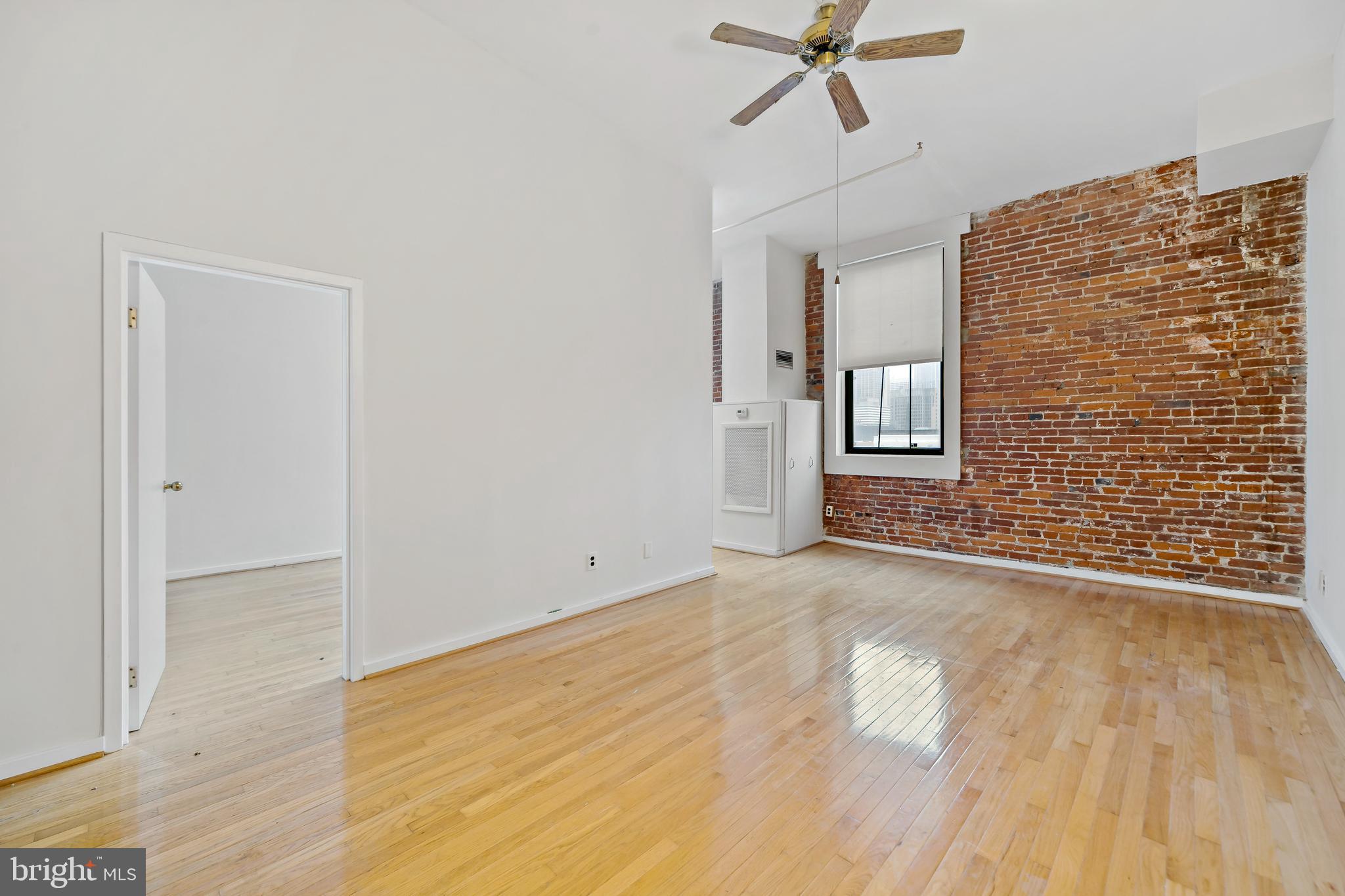 1010 Race Street, Unit PG Philadelphia, PA 19107 - Photo 4 of 14 a view of an empty room and wooden floor