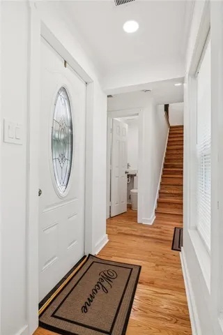a view of kitchen and kitchen with wooden floor
