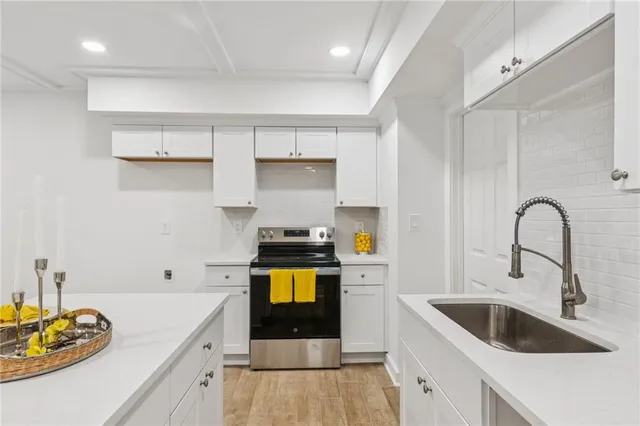 a bathroom with a sink a toilet and bathtub