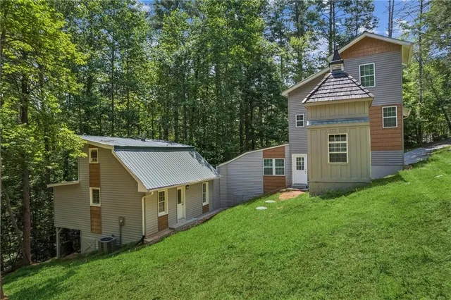 a front view of a house with a garden