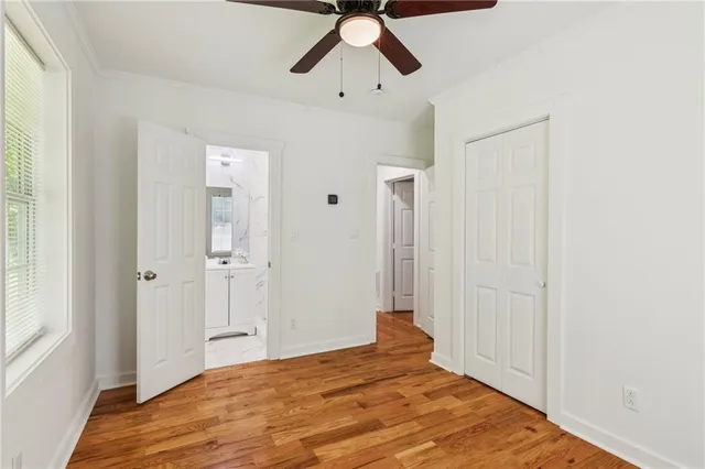 a view of an entryway with wooden floor and door