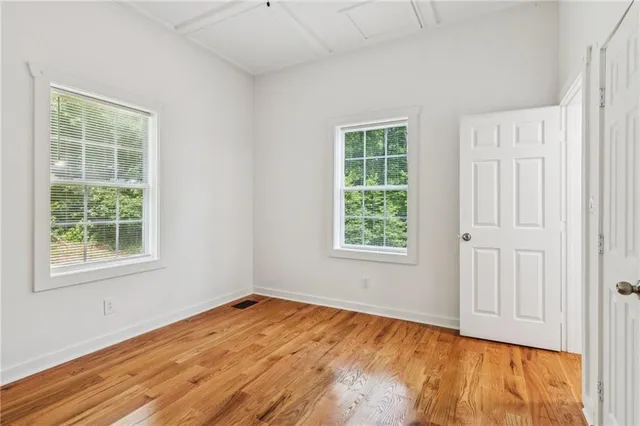wooden floor and windows in an empty room