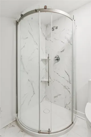 a bathroom with a sink toilet and window