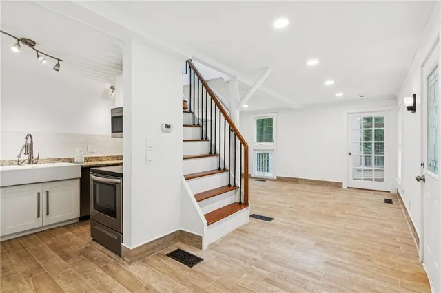 a view of a house with a yard and deck