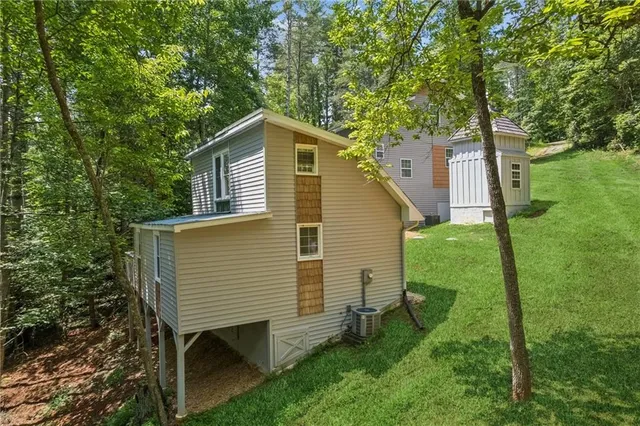 an aerial view of a house with garden space and street view