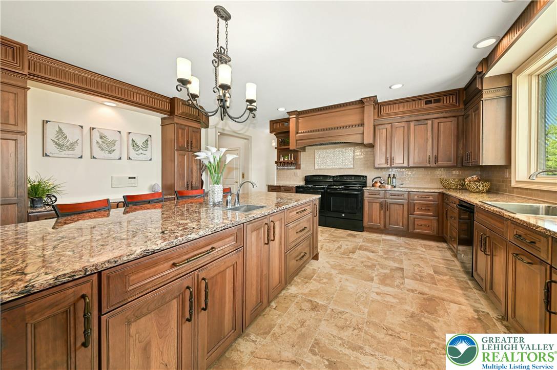 3200 Creamery Road New Hope, PA 18938 - Photo 8 of 42 a large kitchen with stainless steel appliances granite countertop a stove sink and cabinets