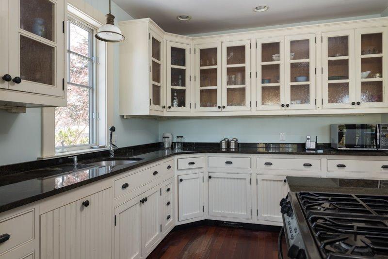 101 Associates Road Falmouth, MA 02540 - Photo 25 of 31 a kitchen with granite countertop a stove sink and cabinets