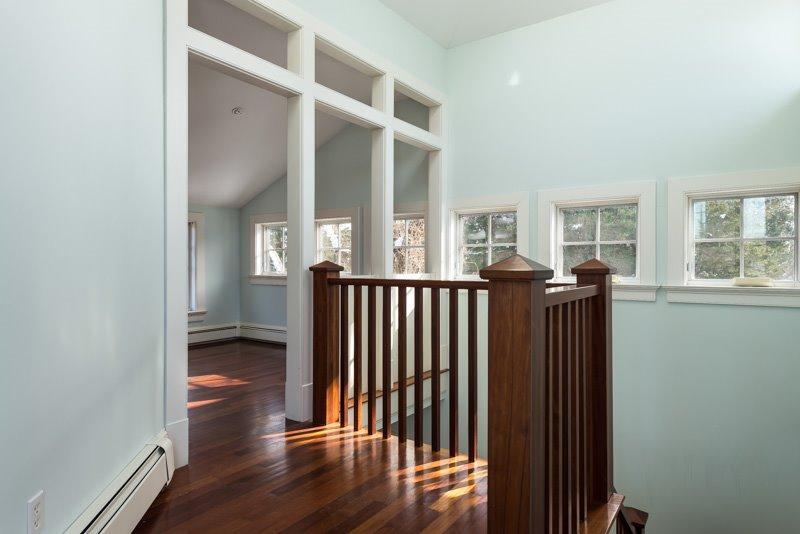 101 Associates Road Falmouth, MA 02540 - Photo 27 of 31 a view of a hallway with wooden floor and windows