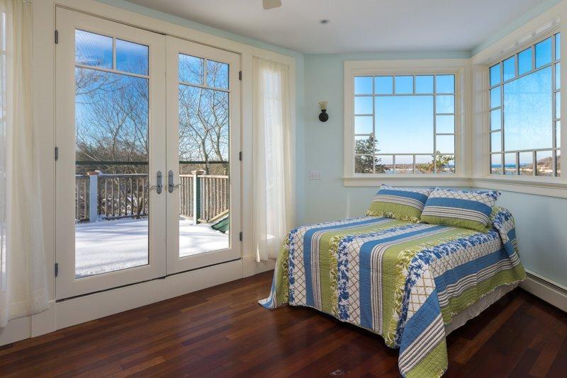 101 Associates Road Falmouth, MA 02540 - Photo 28 of 31 a bedroom with a bed and window