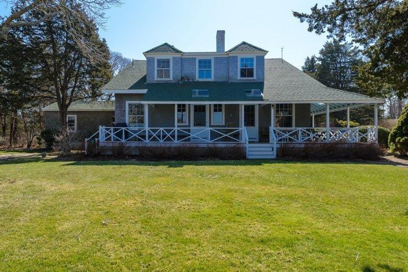 101 Associates Road Falmouth, MA 02540 - Photo 4 of 31 a front view of a house with garden