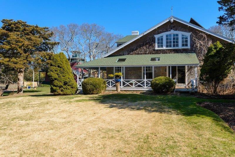101 Associates Road Falmouth, MA 02540 - Photo 5 of 31 a front view of a house with garden