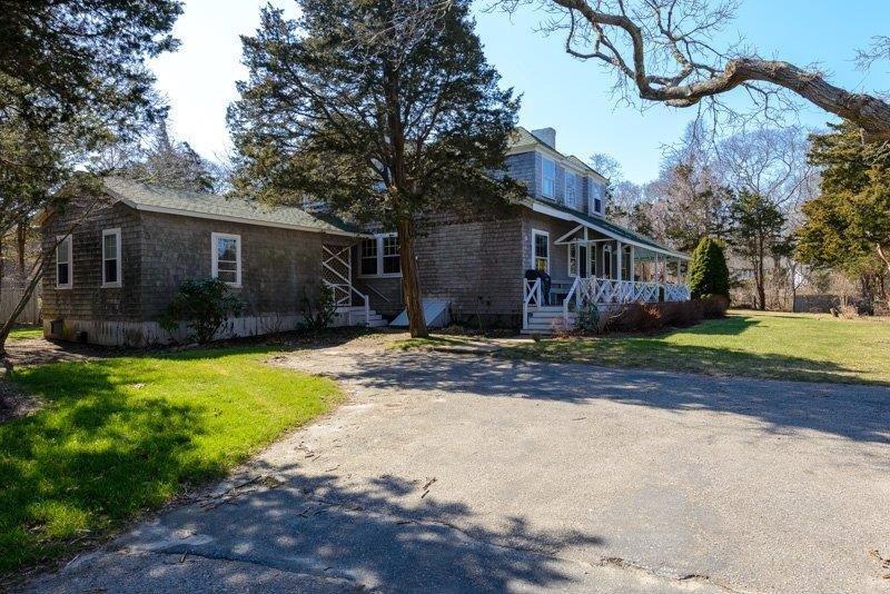 101 Associates Road Falmouth, MA 02540 - Photo 6 of 31 a front view of house with yard and green space