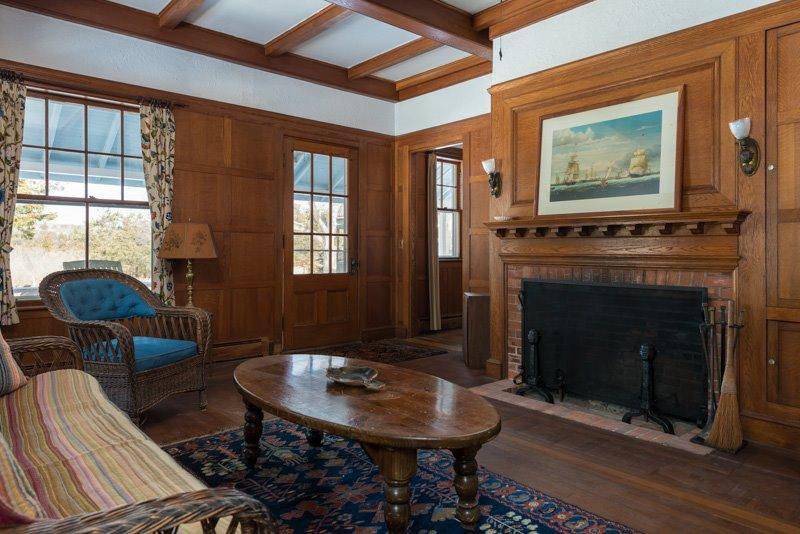 101 Associates Road Falmouth, MA 02540 - Photo 8 of 31 a living room with furniture a table and a fireplace