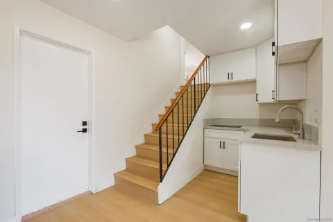 a view of entryway and kitchen