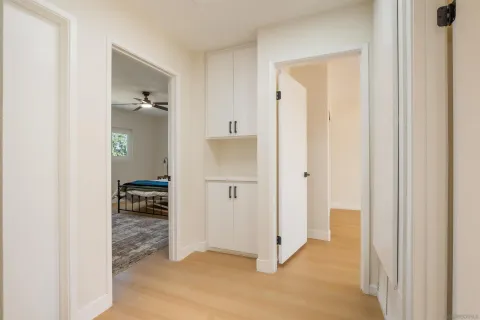 a view of an empty room and bathroom