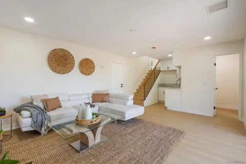 a living room with furniture and a rug