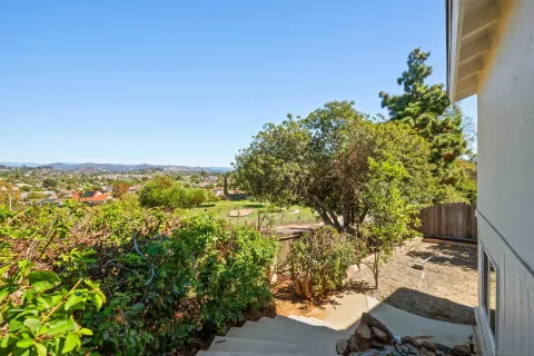 a view of a yard with an outdoor seating