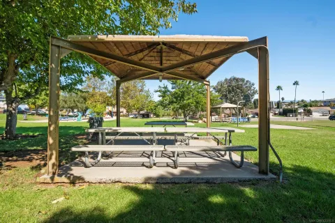 a view of backyard with sitting area