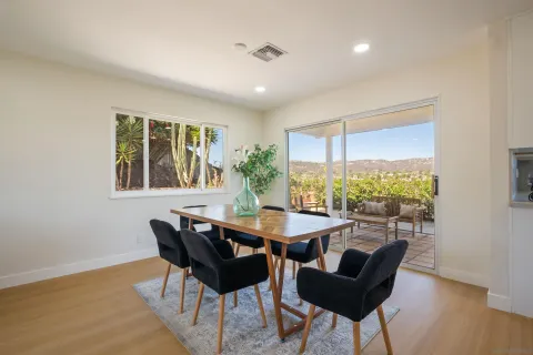 a dining room with furniture and window