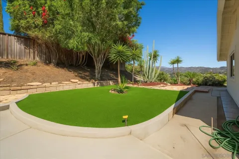a view of a swimming pool with a yard