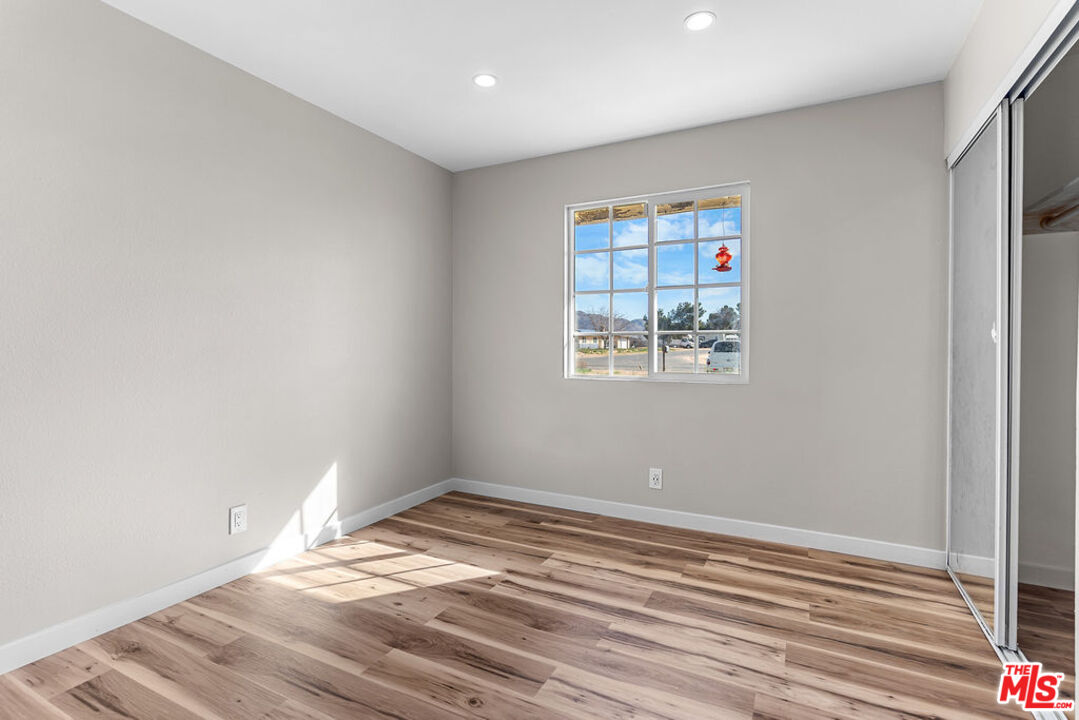16030 Osage Road Apple Valley, CA 92307 - Photo 17 of 27 a view of empty room with wooden floor
