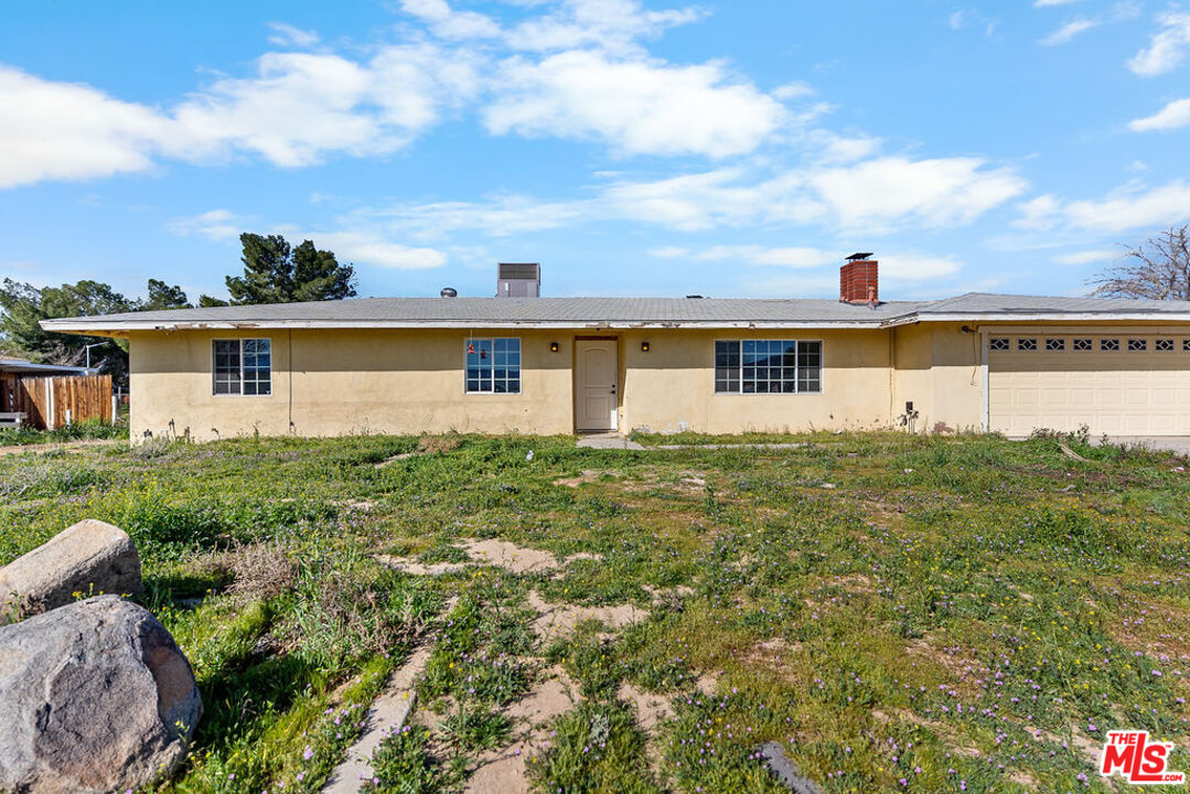 16030 Osage Road Apple Valley, CA 92307 - Photo 3 of 27 a front view of house with a garden