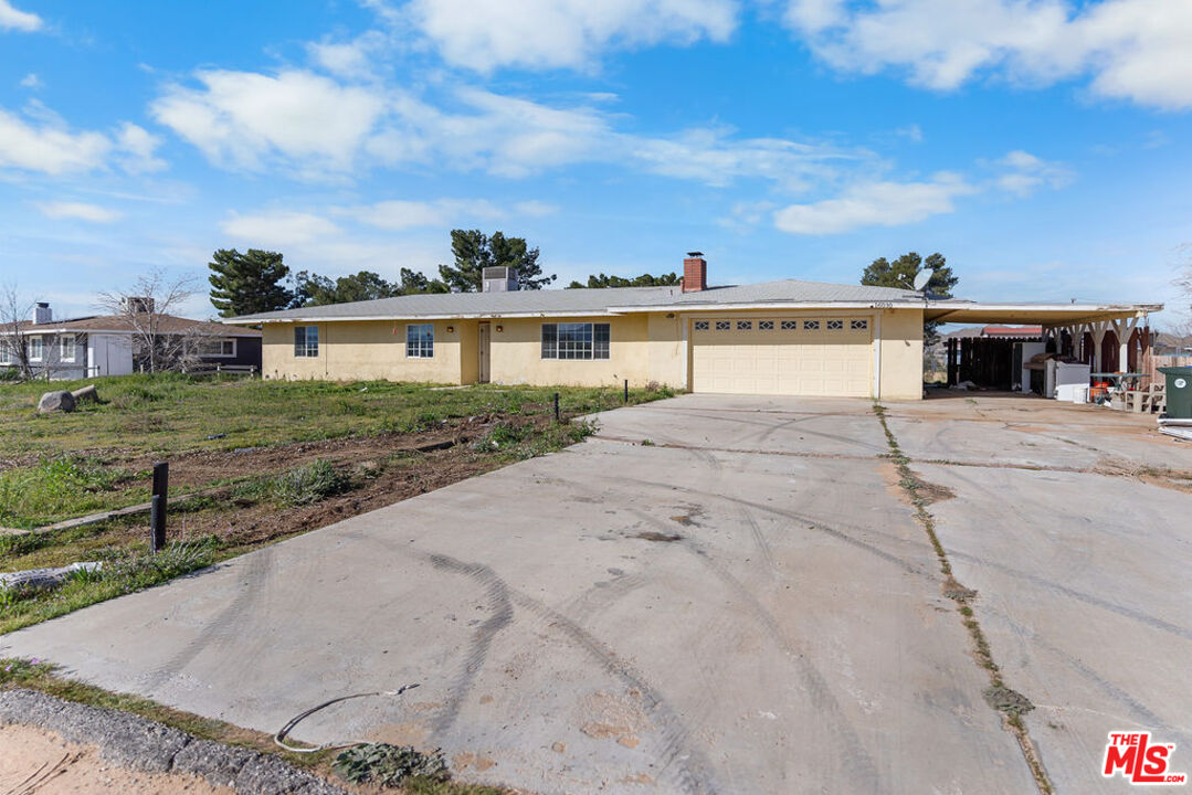 16030 Osage Road Apple Valley, CA 92307 - Photo 5 of 27 a view of house with yard and car parked