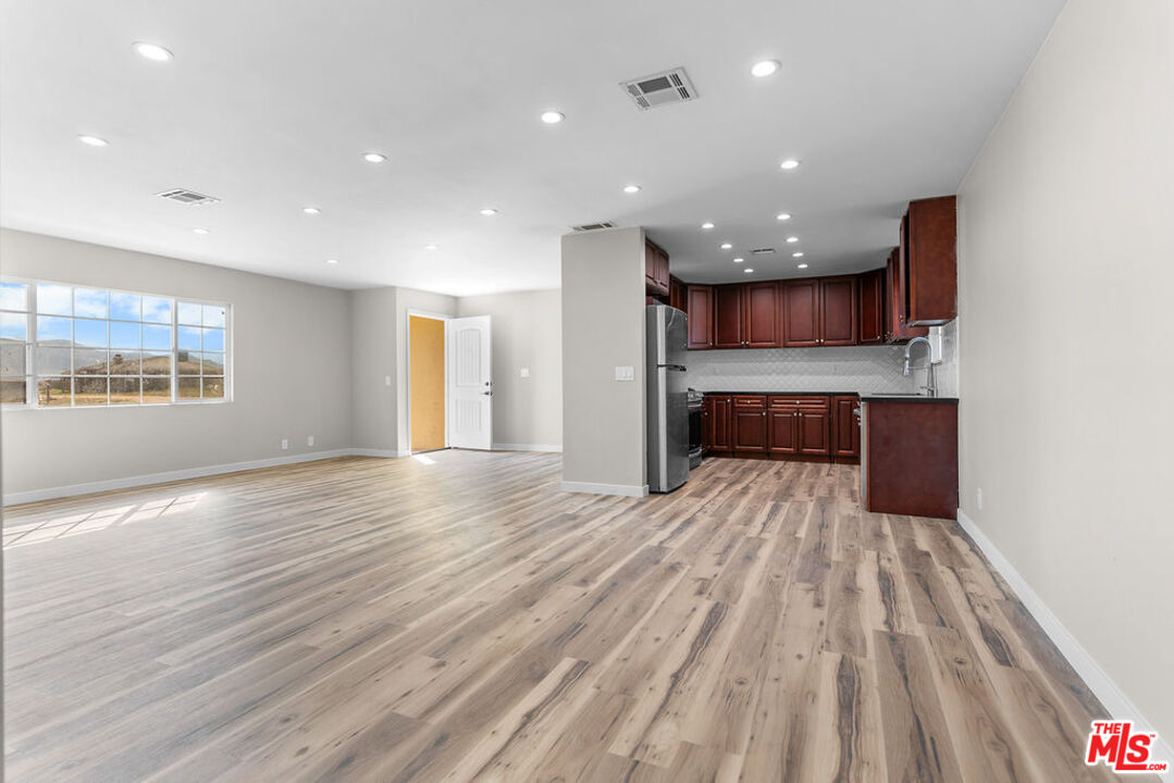 16030 Osage Road Apple Valley, CA 92307 - Photo 8 of 27 a view of kitchen and kitchen with a hallway