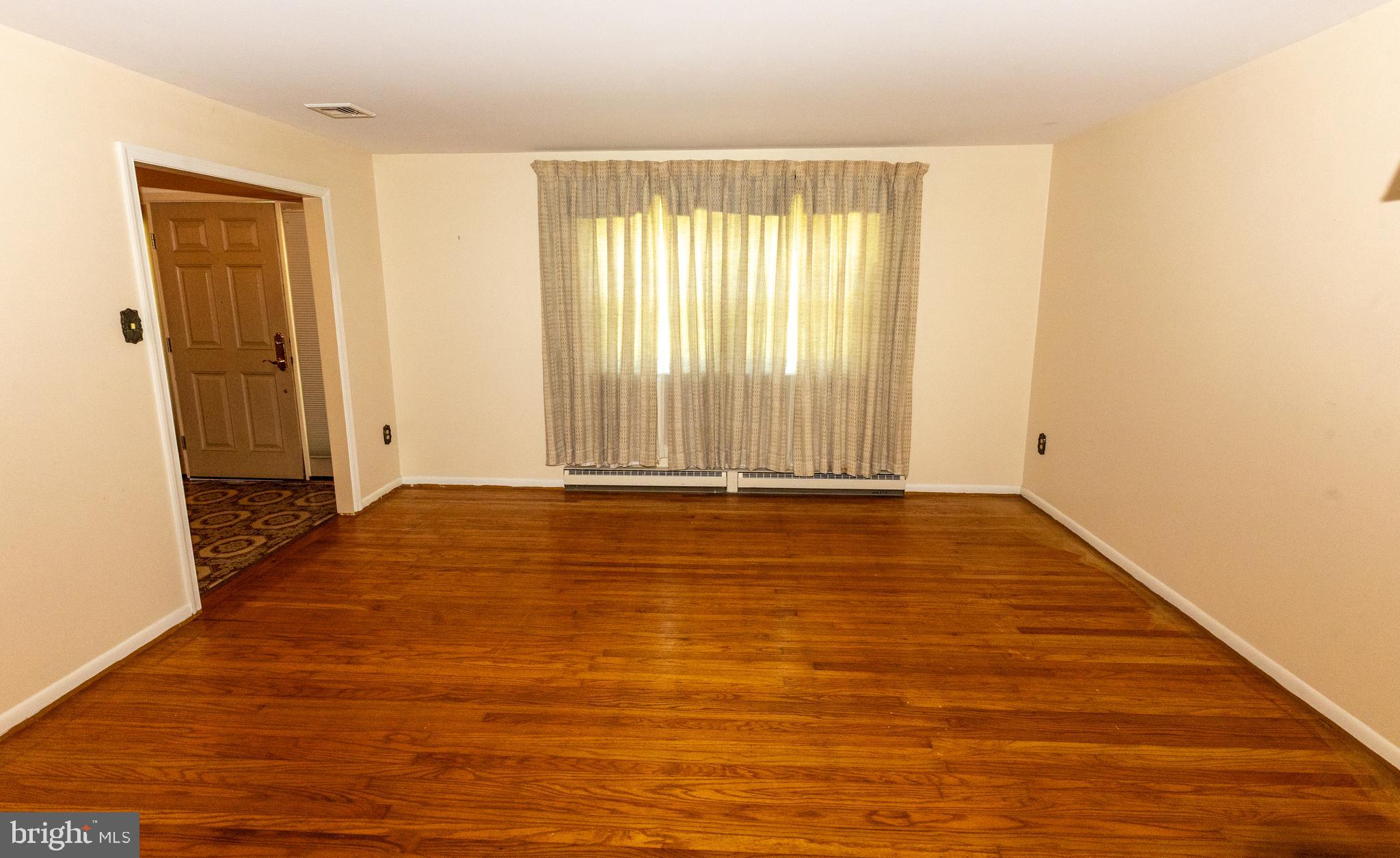 1929 Hillendale Road Chadds Ford, PA 19317 - Photo 20 of 56 a view of an empty room with wooden floor and a window