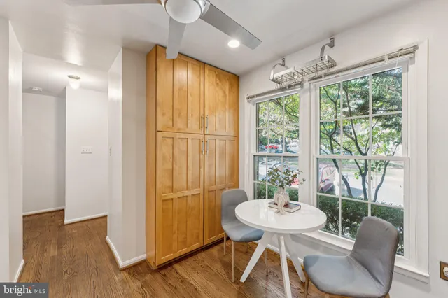 a view of an empty room with a fireplace and a window