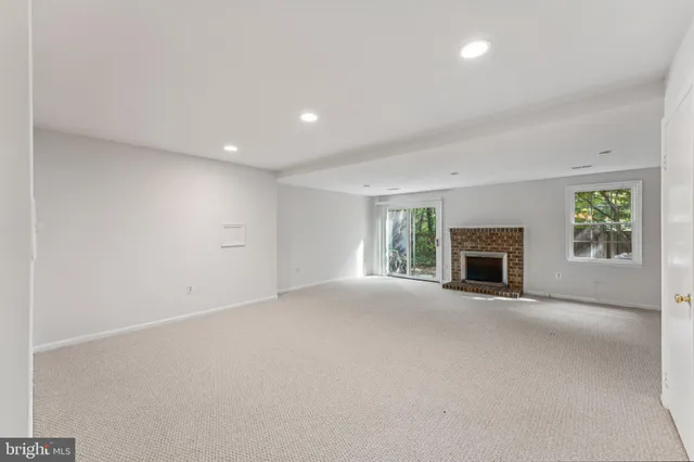 a bathroom with a sink mirror vanity and toilet