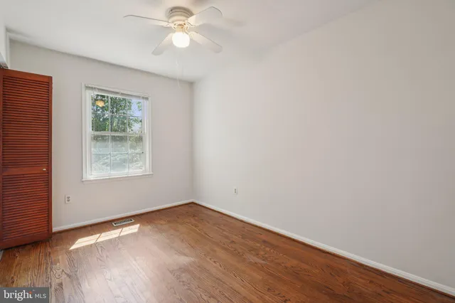 a view of backyard of house with green space