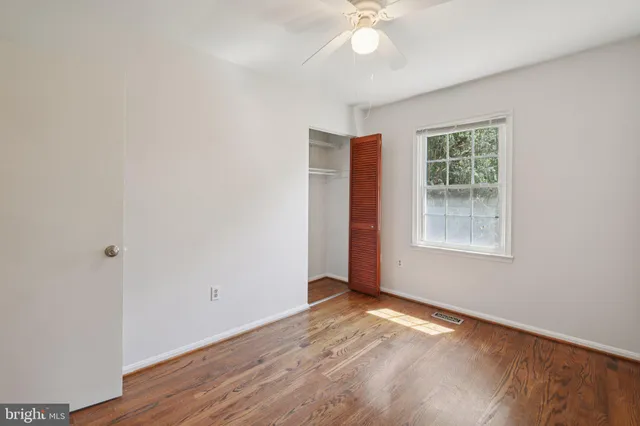 a view of outdoor space with trees all around